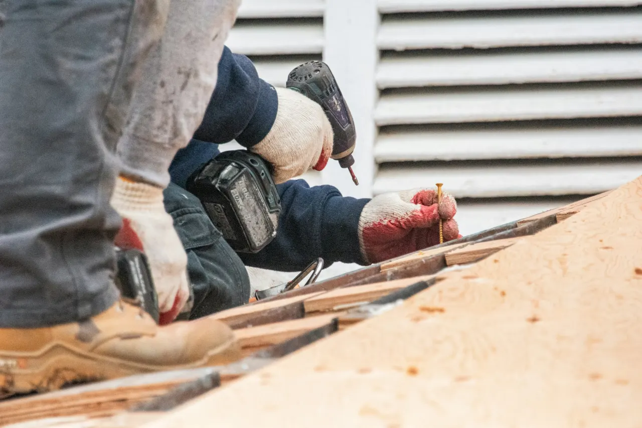 Roofer installing decking